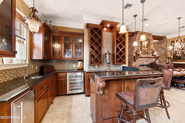 bar with pendant lighting, crown molding, sink, and wine cooler