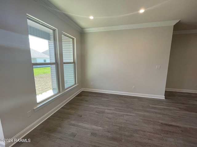 unfurnished room featuring dark hardwood / wood-style floors and ornamental molding