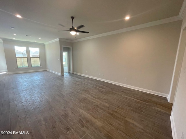 empty room with ceiling fan, crown molding, and dark hardwood / wood-style flooring