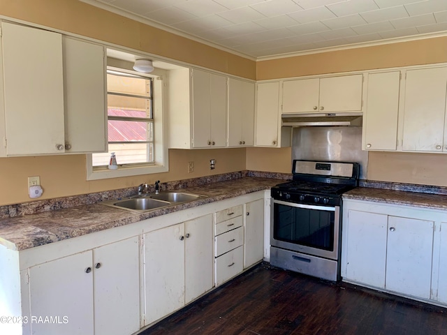 kitchen with stainless steel gas range oven, white cabinetry, dark wood-type flooring, sink, and crown molding