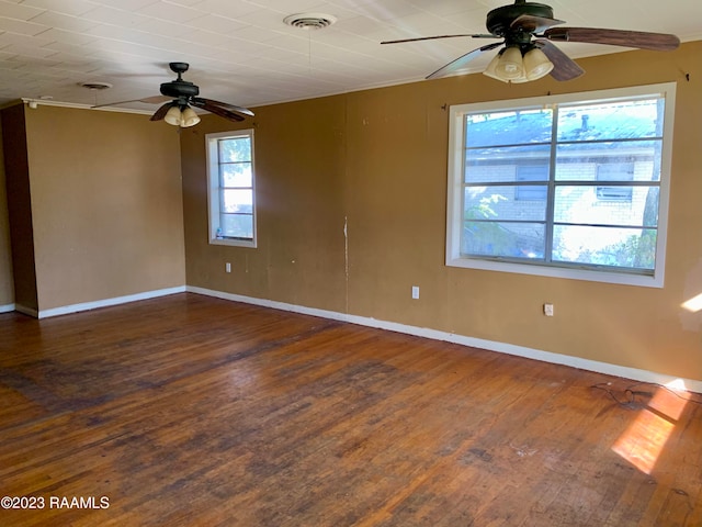 spare room featuring ceiling fan and dark hardwood / wood-style floors