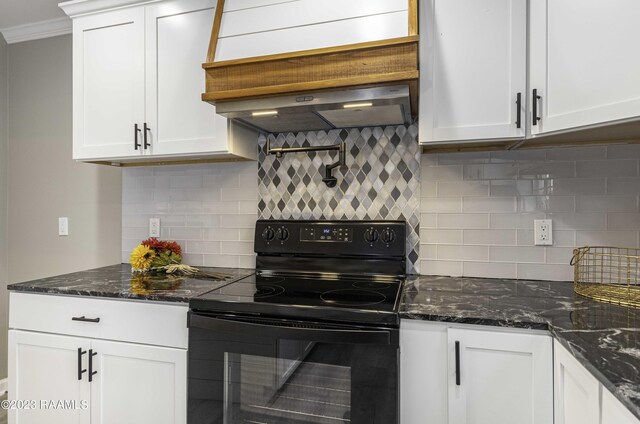 kitchen featuring decorative backsplash, black range with electric stovetop, and dark stone counters