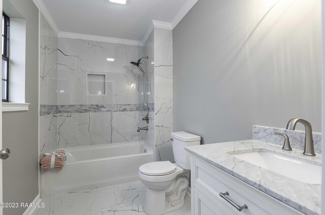 full bathroom with vanity, tile patterned floors, tiled shower / bath, ornamental molding, and toilet