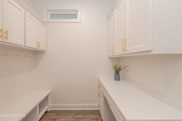 laundry room with light wood-type flooring