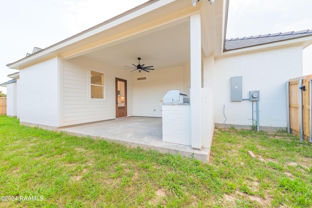 exterior space featuring ceiling fan and electric panel