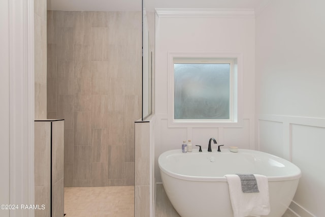 bathroom featuring plus walk in shower and crown molding