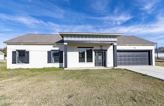 view of front of home featuring a garage and a front lawn