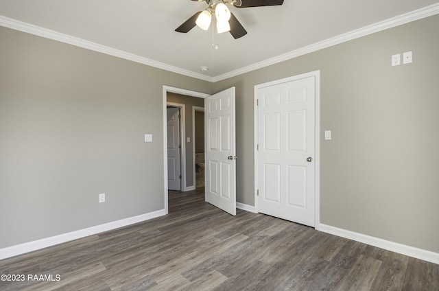 unfurnished bedroom featuring ceiling fan, crown molding, and wood-type flooring