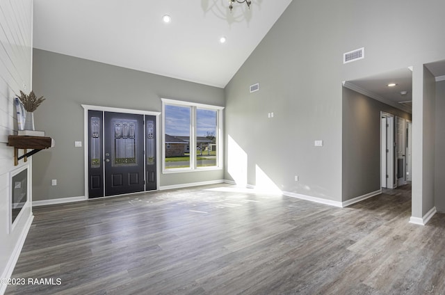 entrance foyer with dark wood-type flooring, high vaulted ceiling, and an inviting chandelier