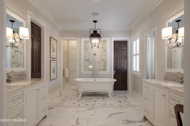 bathroom with vanity, crown molding, a tub, and a chandelier