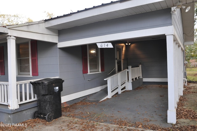 view of exterior entry featuring a porch