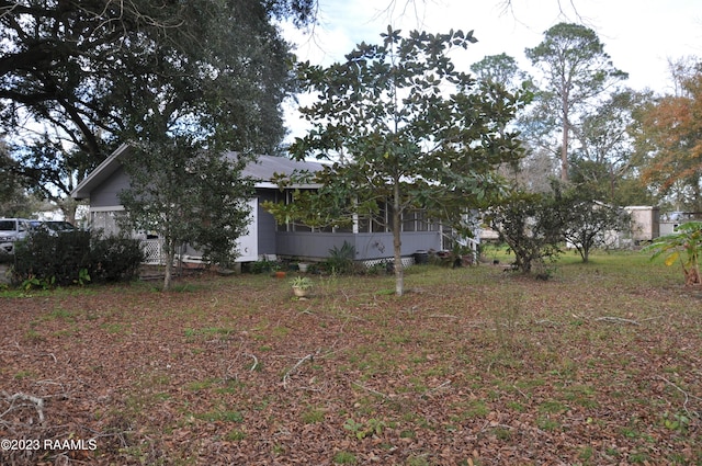 view of yard with a sunroom
