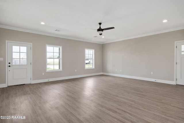 unfurnished living room with recessed lighting, ornamental molding, a ceiling fan, wood finished floors, and baseboards