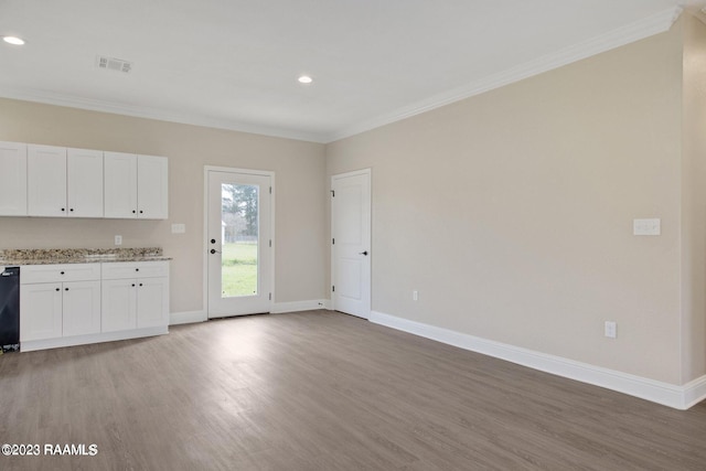 kitchen featuring dishwasher, crown molding, visible vents, and baseboards