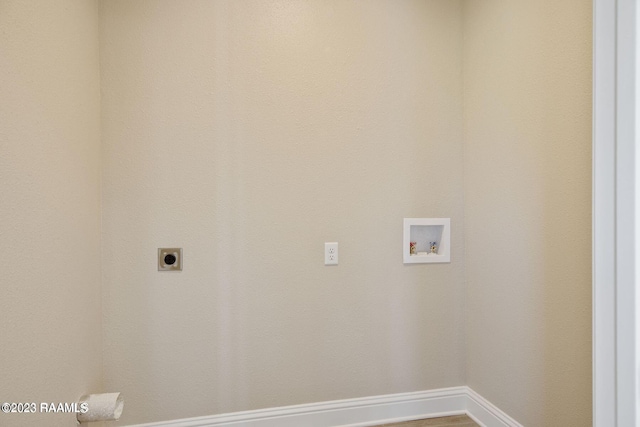 clothes washing area with hookup for a washing machine, baseboards, laundry area, and electric dryer hookup