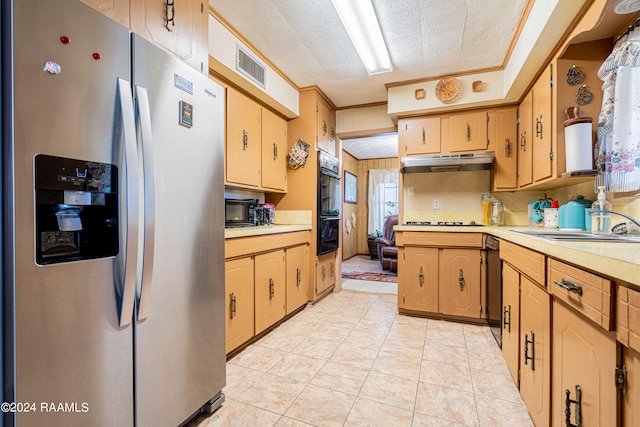 kitchen featuring ornamental molding, black appliances, a textured ceiling, and light tile flooring