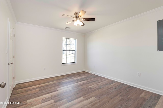 unfurnished room featuring dark hardwood / wood-style floors, ornamental molding, and ceiling fan