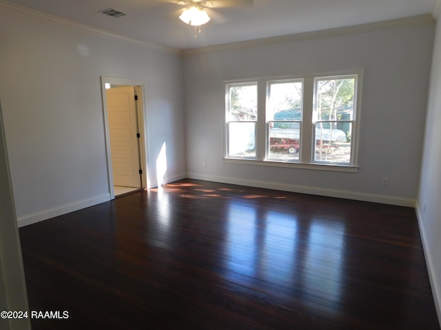 spare room featuring ceiling fan, ornamental molding, and dark hardwood / wood-style floors