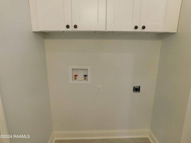 laundry area with washer hookup, cabinets, and electric dryer hookup