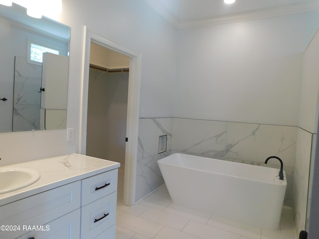 bathroom with crown molding, vanity, a bath to relax in, and tile flooring