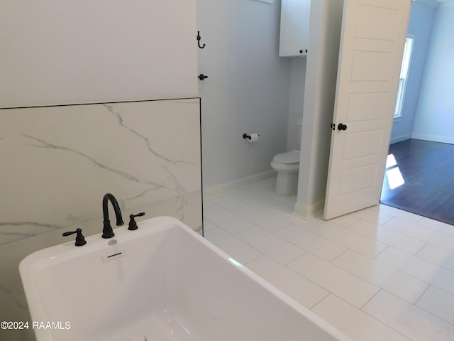 bathroom featuring toilet and hardwood / wood-style flooring