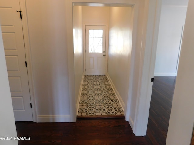 corridor featuring dark hardwood / wood-style floors