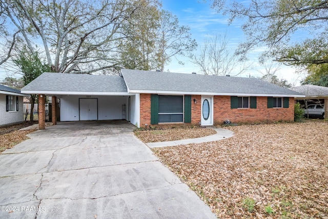 ranch-style home featuring a carport