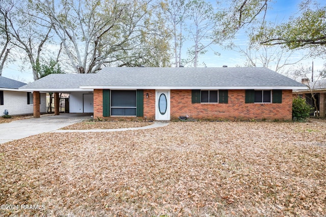 ranch-style house with a carport