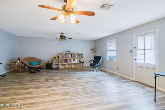 misc room featuring light hardwood / wood-style floors and ceiling fan