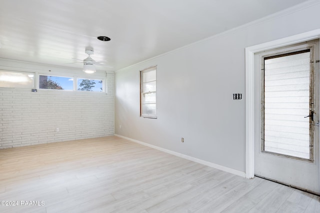 spare room with ceiling fan, light hardwood / wood-style floors, and crown molding