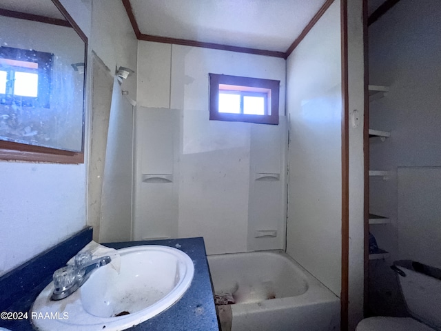 full bathroom featuring vanity, crown molding, shower / washtub combination, and toilet