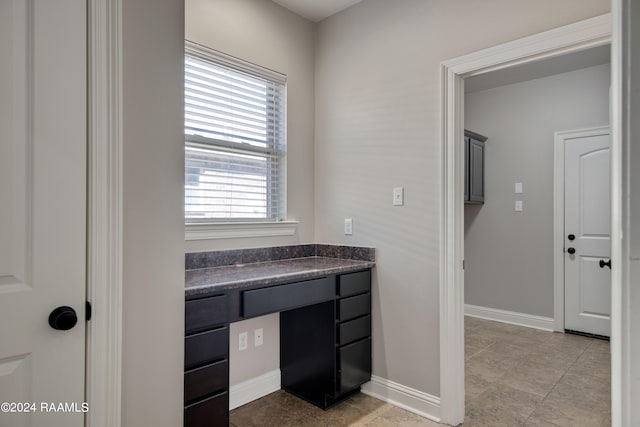 bathroom with vanity and tile floors