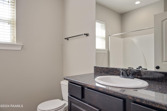 bathroom with oversized vanity and toilet