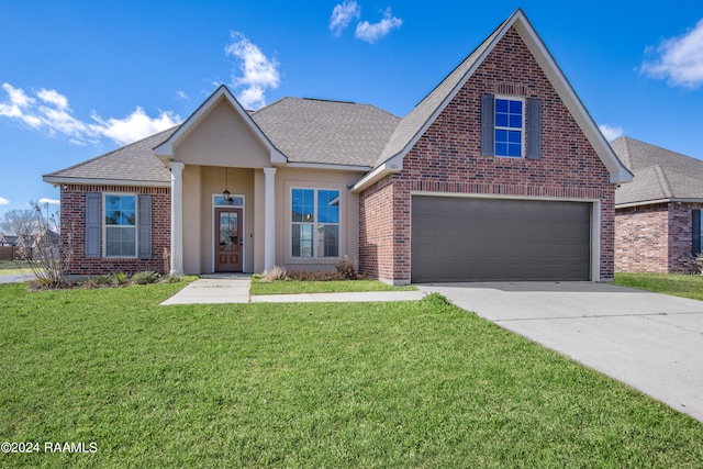 view of front facade with a front lawn and a garage