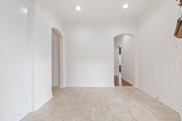 spare room with ornamental molding