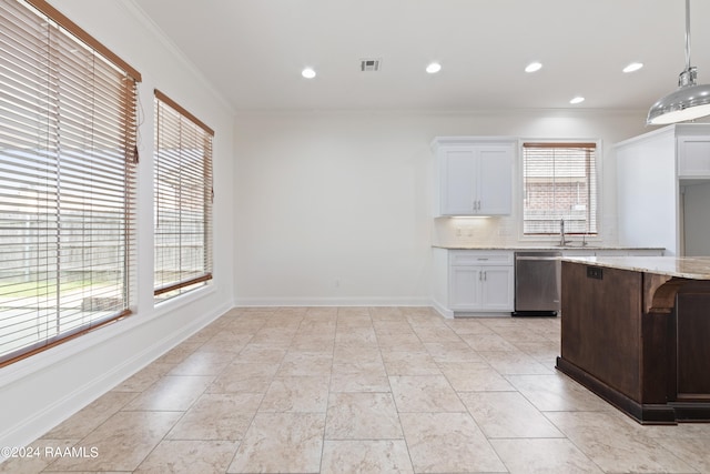 kitchen with dishwasher, hanging light fixtures, ornamental molding, tasteful backsplash, and white cabinetry