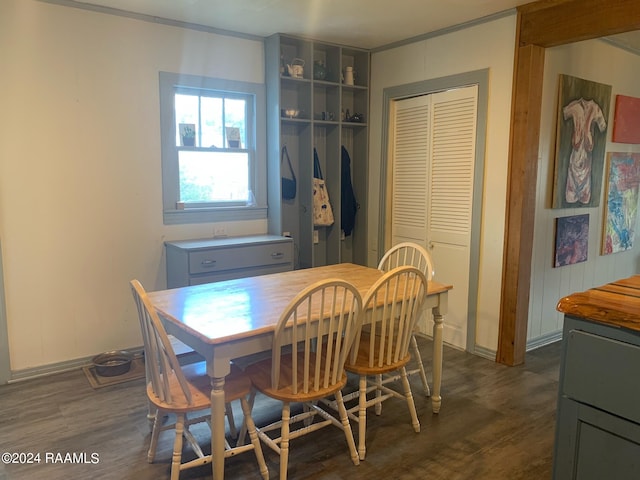 dining space with dark hardwood / wood-style floors