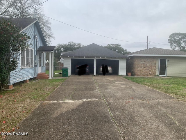 view of property exterior with a garage and a yard
