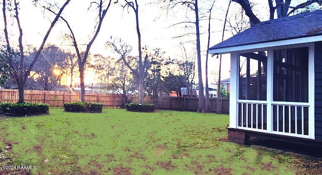 view of yard at dusk