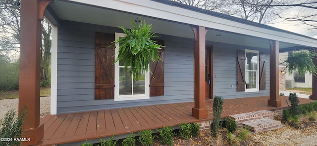 view of property exterior with a porch