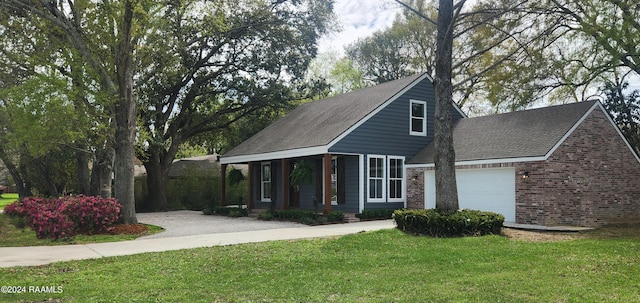 view of front of property with a garage and a front lawn