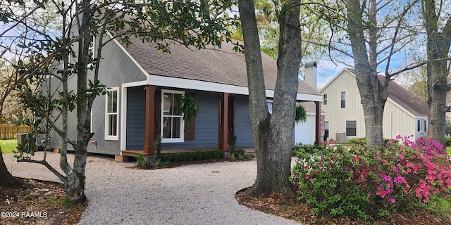 view of front of property with a garage and covered porch