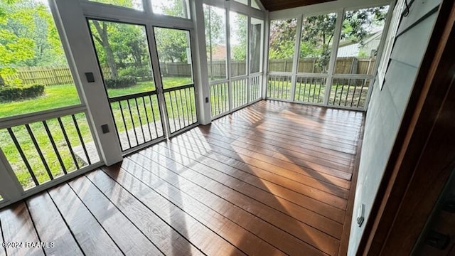 unfurnished sunroom with plenty of natural light