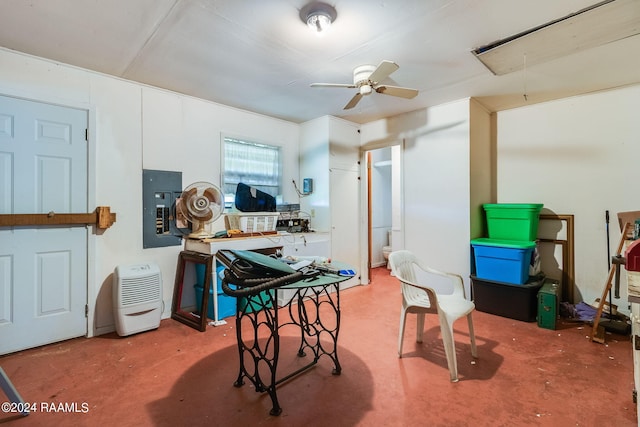 interior space featuring ceiling fan and concrete flooring