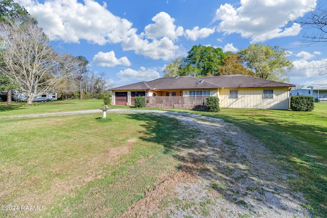 ranch-style house with a front lawn