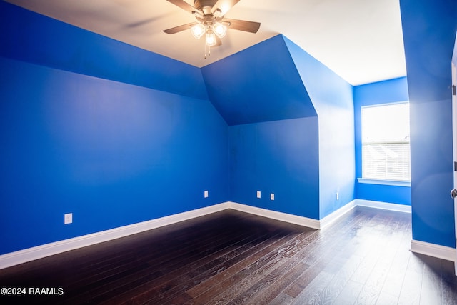 bonus room with vaulted ceiling, ceiling fan, and dark hardwood / wood-style flooring