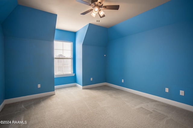 bonus room with light carpet, ceiling fan, and vaulted ceiling