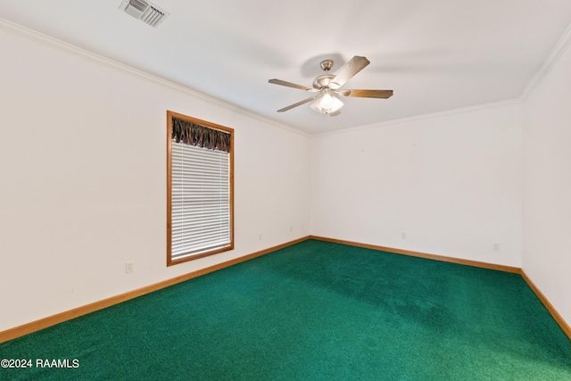 empty room with ceiling fan, crown molding, and dark carpet