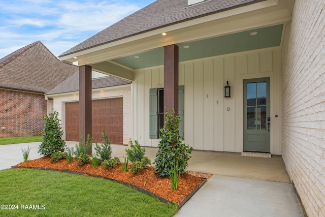 view of exterior entry with a garage