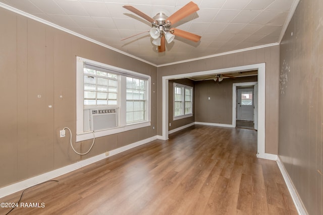 spare room featuring ceiling fan, light hardwood / wood-style flooring, and ornamental molding